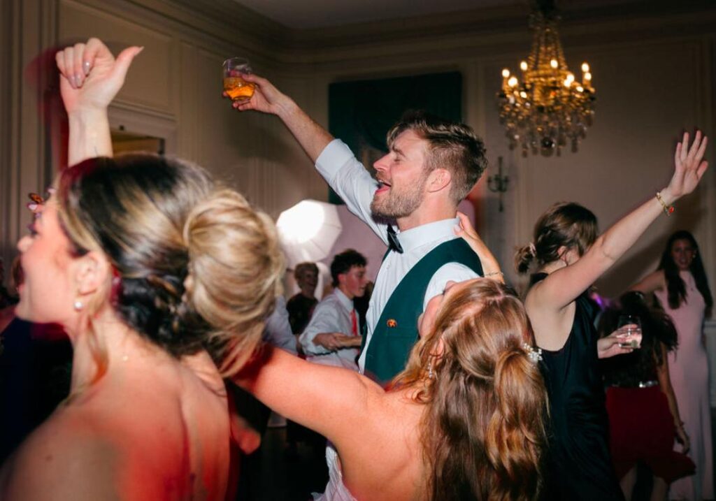 Packed dance floor with guests singing along
