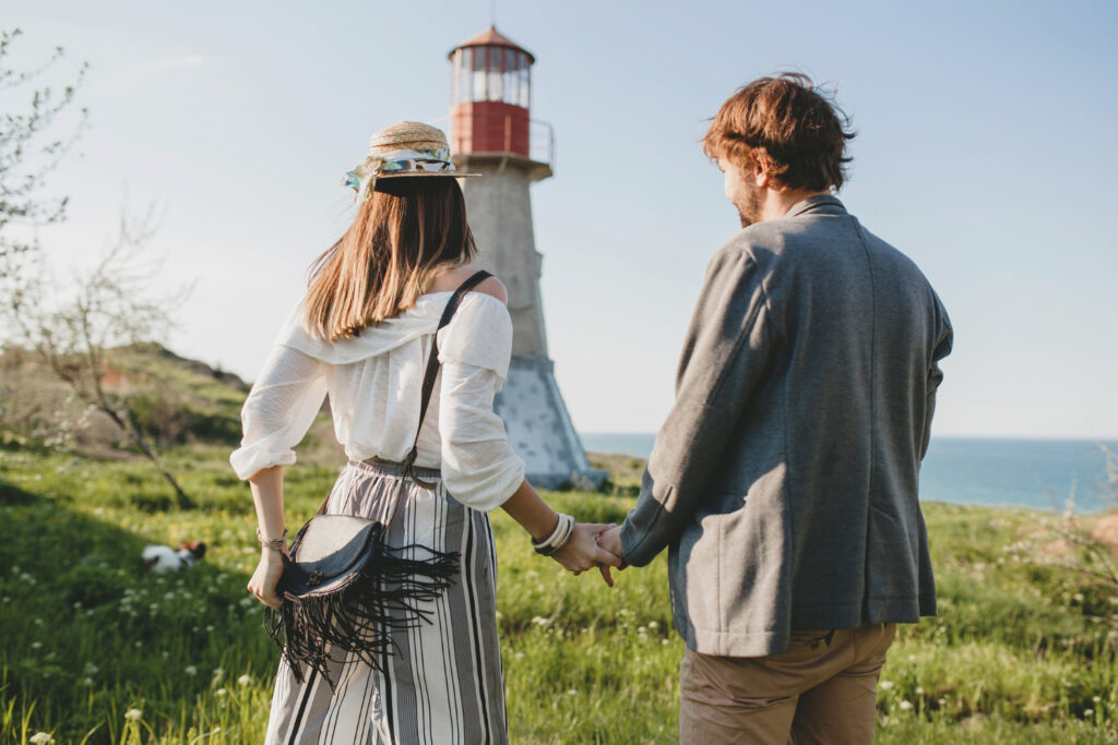 Couple in front of a lighthouse in Portland ME
